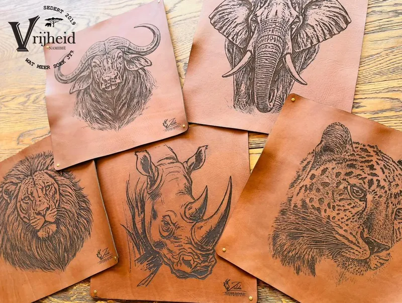 Leather placemats engraved with a buffalo, elephant, lion, rhino and leopard